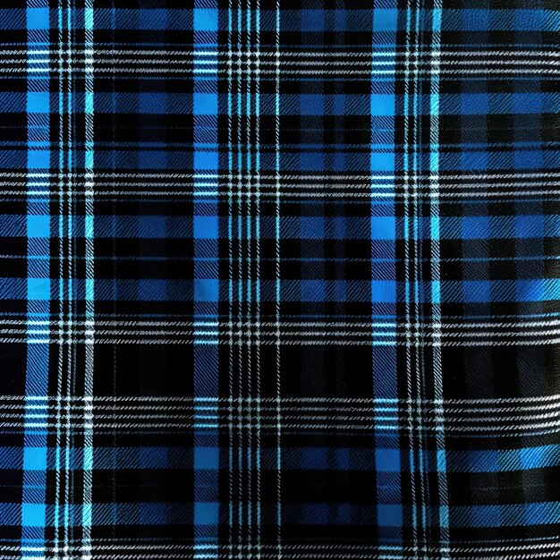 a close up of a blue and black plaid tartan