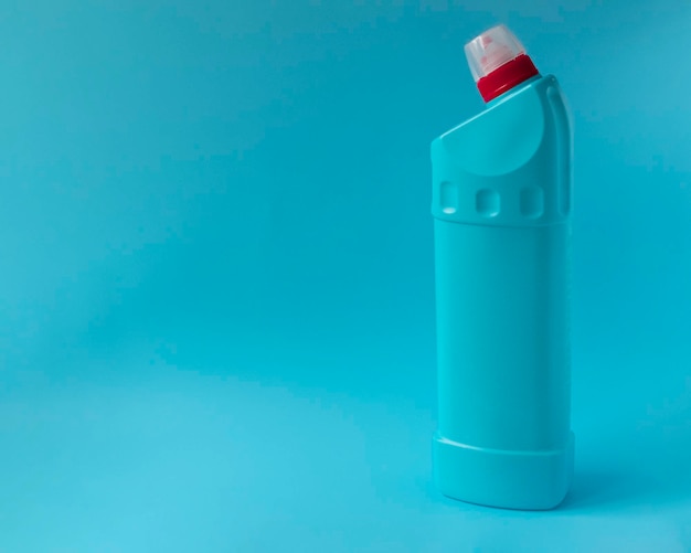 close-up of blue bottle against white background