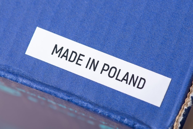 Close up of blue box of shoes with inscription Made in Poland Production of shoes in Poland concept