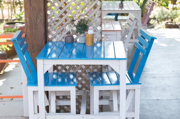 Photo close up of  blue dining table set in food court