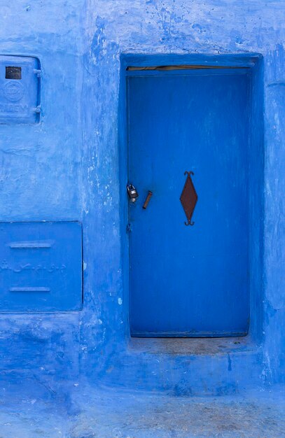 Close-up of blue door on old building