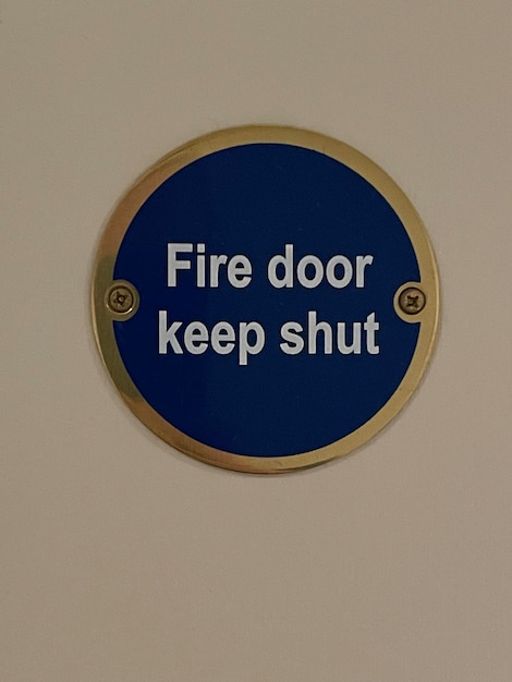 Close up of blue fire door sign