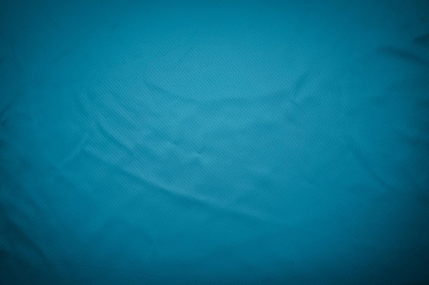 Close up blue football jersey clothing fabric texture sports wear background Sport Clothing Fabric