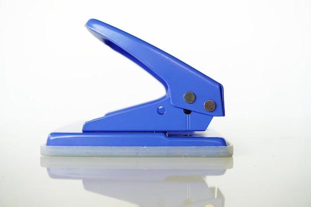 Photo close-up of blue hole puncher on white background