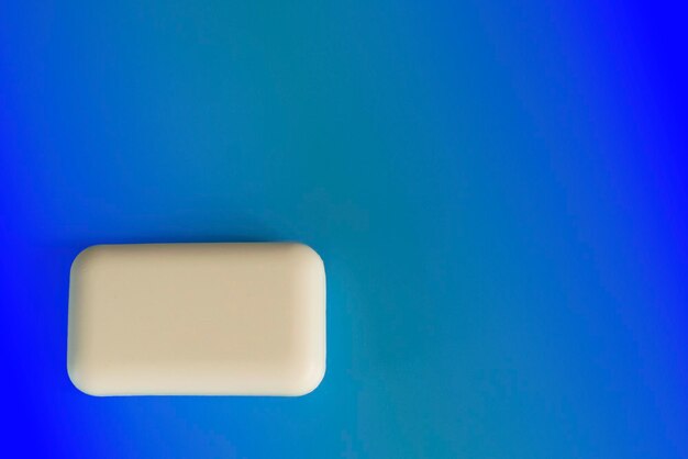 Close-up of blue object over white background