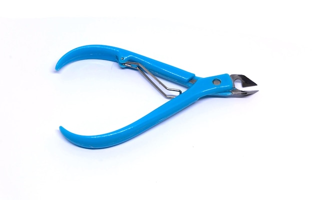 Close-up of blue plier over white background