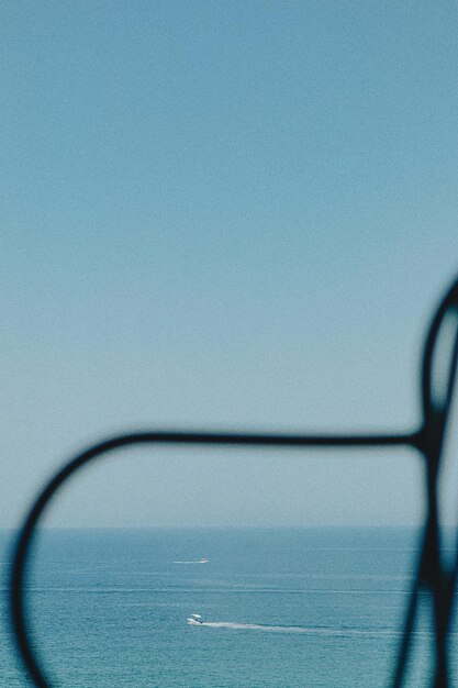 Close-up of blue sea against clear sky