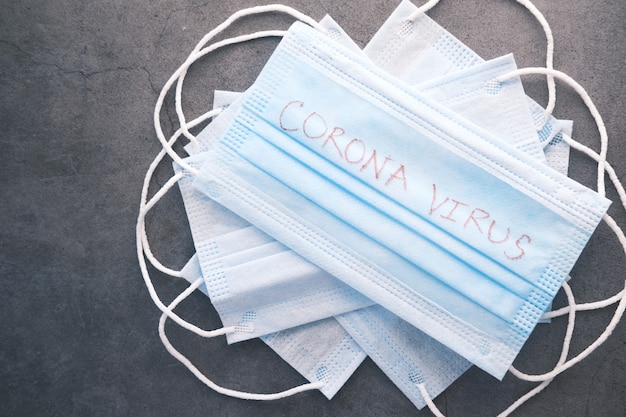 Close up of blue surgical masks on table