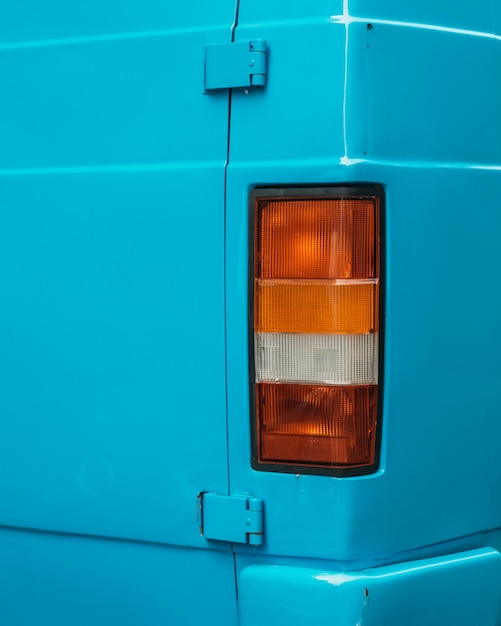 A Close Up Of A Blue Van s Tail Light