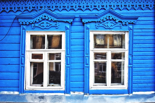 Photo close-up of blue wall with closed windows