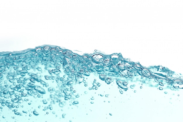 Close up blue water splash with air bubbles. Fresh and clean surface aqua flowing in wave and clean water isolated. 