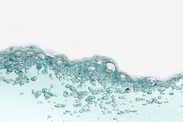 Close up blue water splash with air bubbles