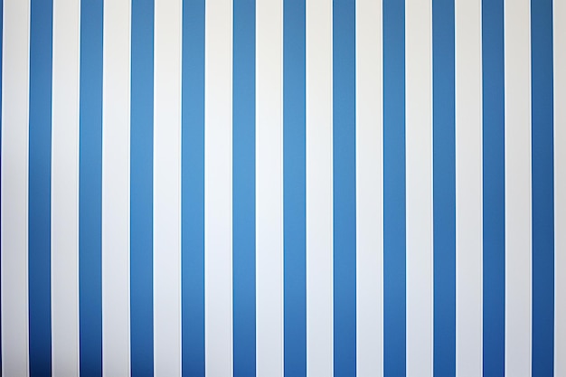 A close up of a blue and white striped wallpaper with vertical lines