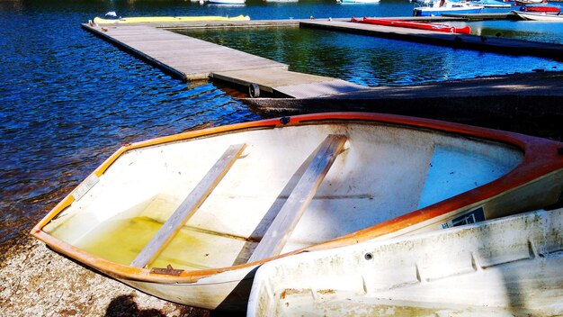 Close-up of boat moored in water