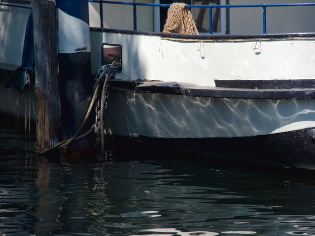 Close-up of boat moored in water