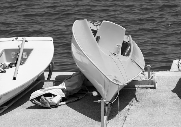 Close-up of boats on dock by sea