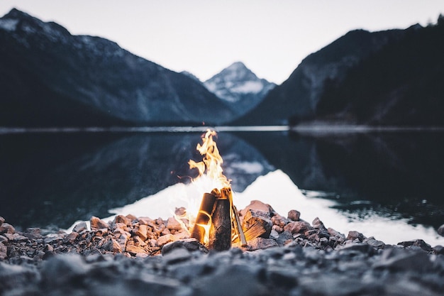 close-up of bonfire against mountain