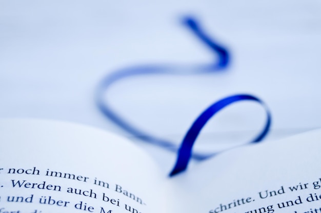 Photo close-up of book with blue bookmark