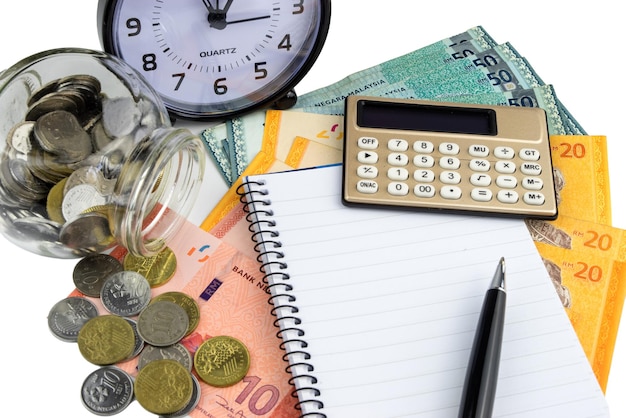 Close-up of books and calculator on white background