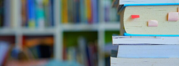 Close-up of books on shelf against wall