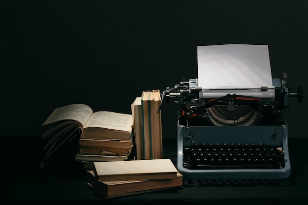close-up of books on table against black background