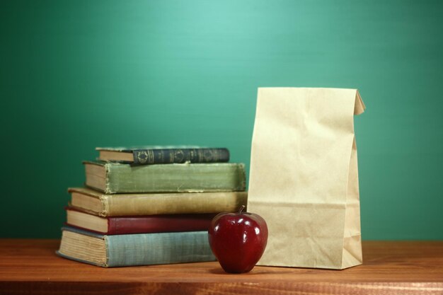 Close-up of books on table against blue background