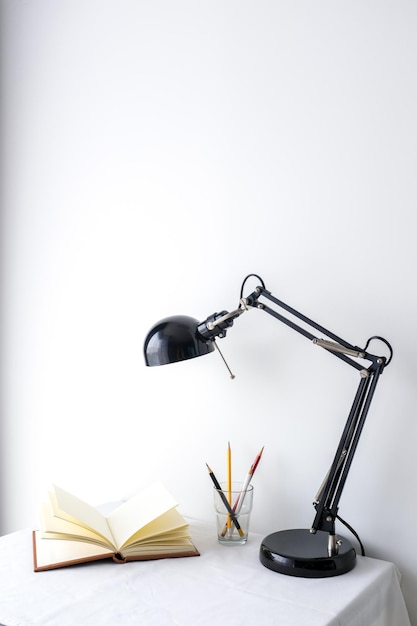 Close-up of books on table against white background