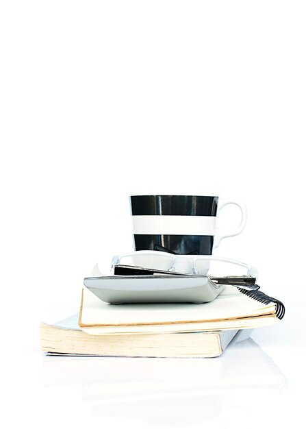 Close-up of books on table against white background