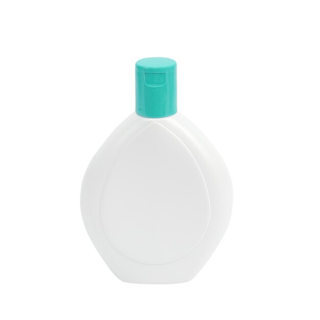 Photo close-up of bottle against white background