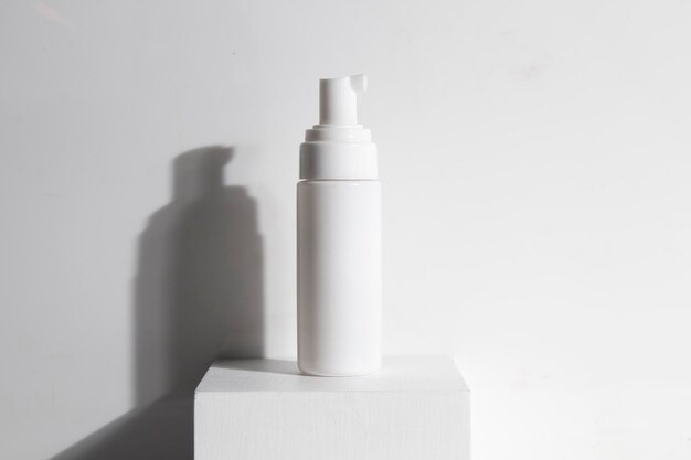 Photo close-up of bottle against white background