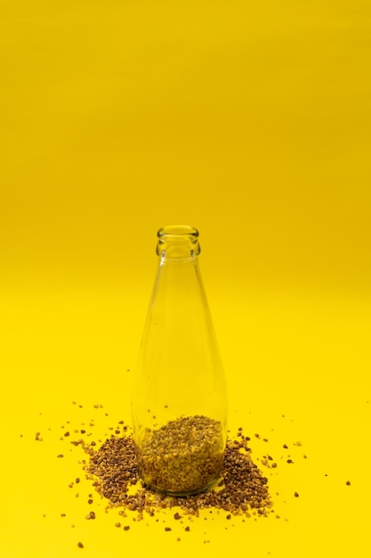 Close-up of bottle against yellow background