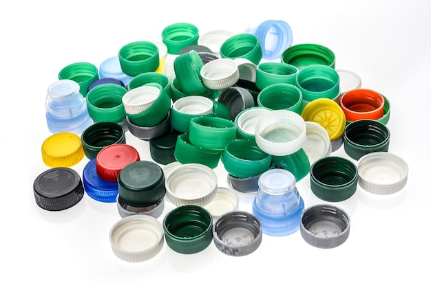 Close-up of bottle caps over white background