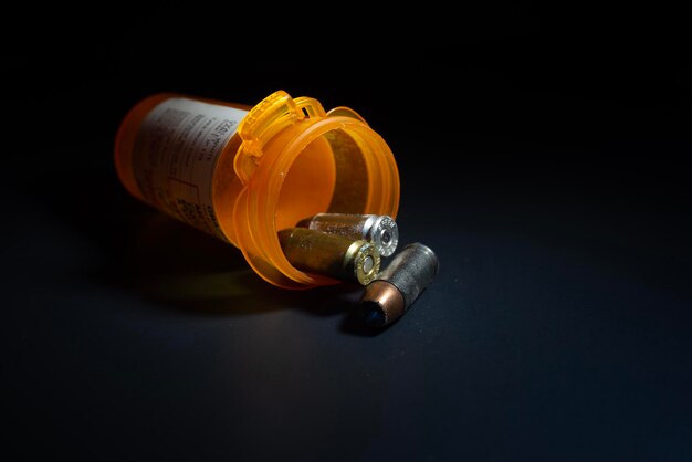 close-up of bottle on table against black background