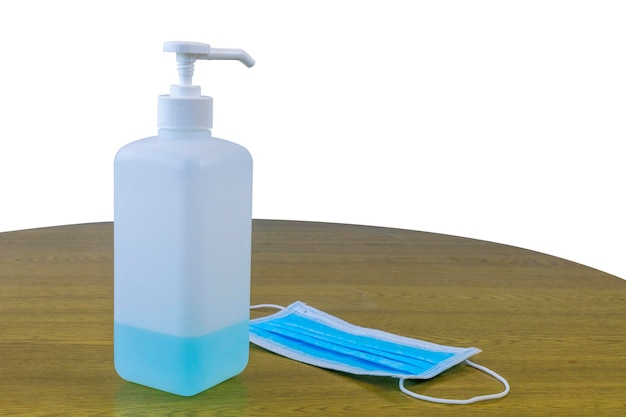 Photo close-up of bottle on table against white background