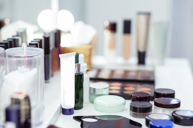 Close up of a bottle with facial cream standing on the table