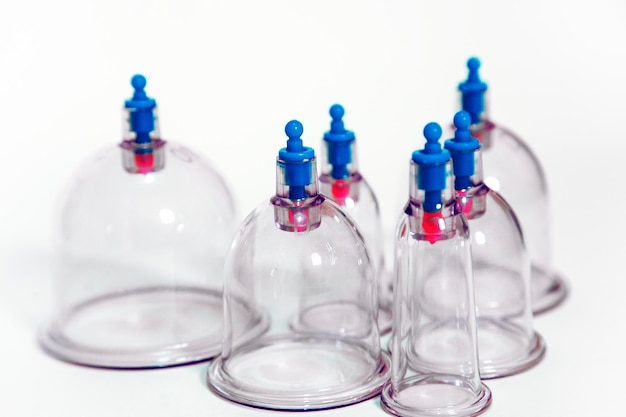 Photo close-up of bottles against blue background