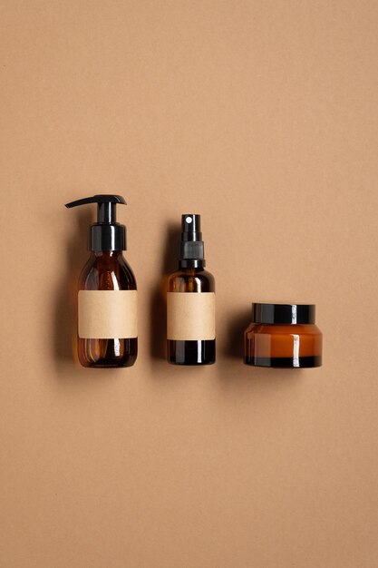 Close-up of bottles on table against wall