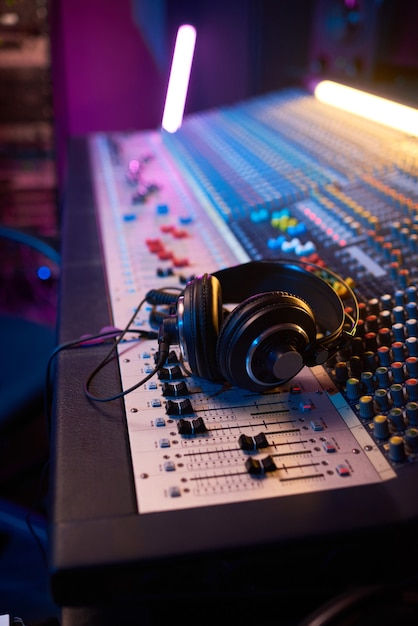 Close-up of boutique recording studio control desk with
headphones on it in the recording studio