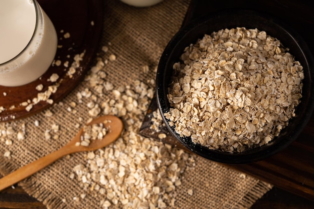 A Close-up of a bowl with oatmeal on a kitchen table. Chopped sight. Overhead view.