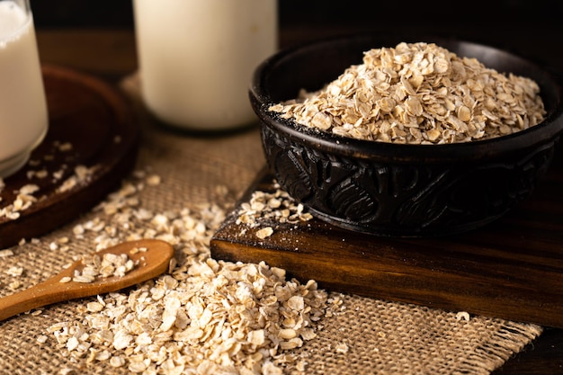 A Close-up of a bowl with oatmeal on a kitchen table. Chopped sight.