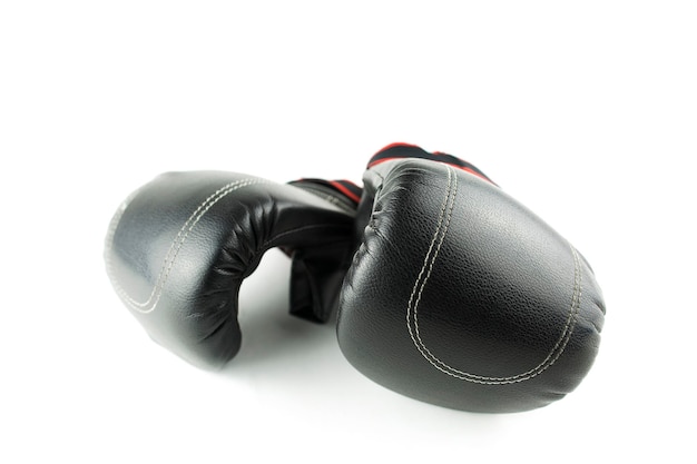 Close-up of boxing gloves against white background