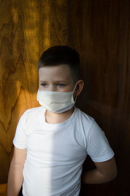 Close-up of boy against wall