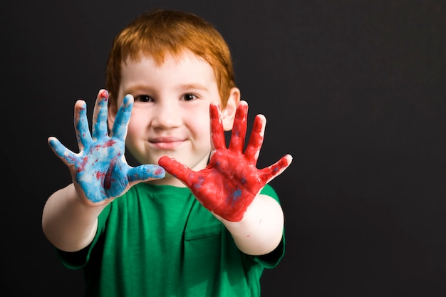 Close up on boy draws with his hands