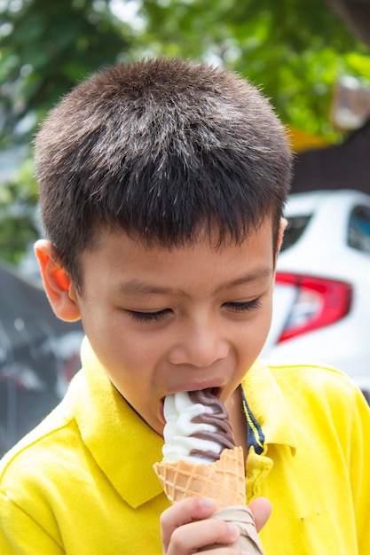 Close-up of boy eating ice cream