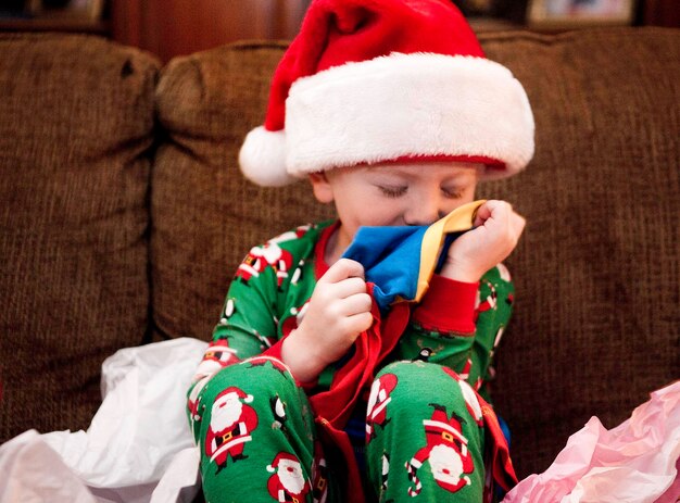 Close-up of boy wearing hat