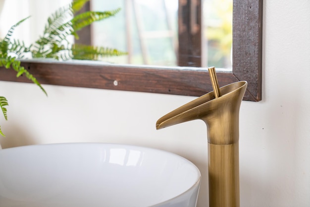 Close up brass tap on bath room