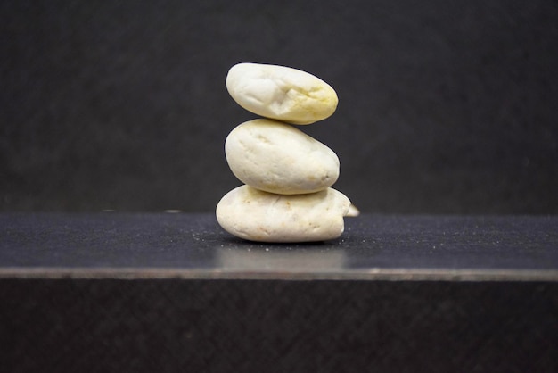 close-up of bread on table against black background