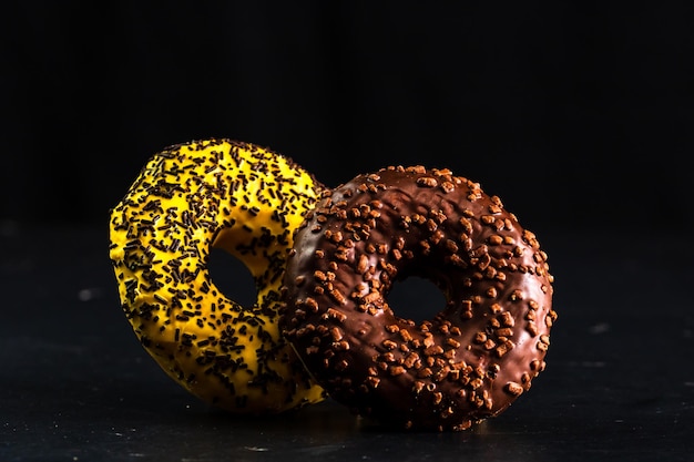 Close-up of bread on table against black background