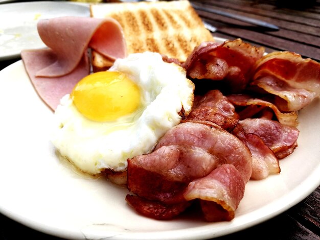 Close-up of breakfast served in plate on table