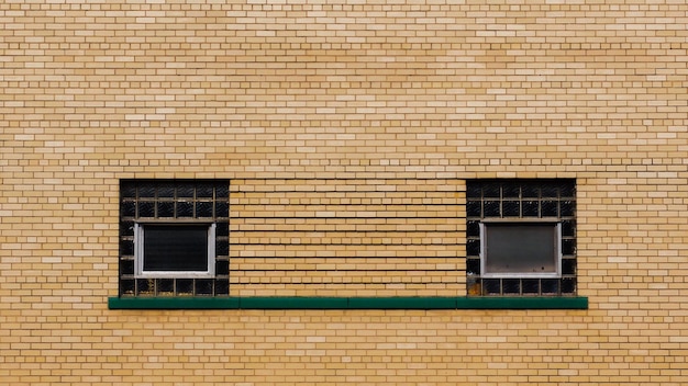 close-up of brick wall with air conditioners